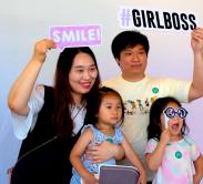 family taking their photos at photo booth